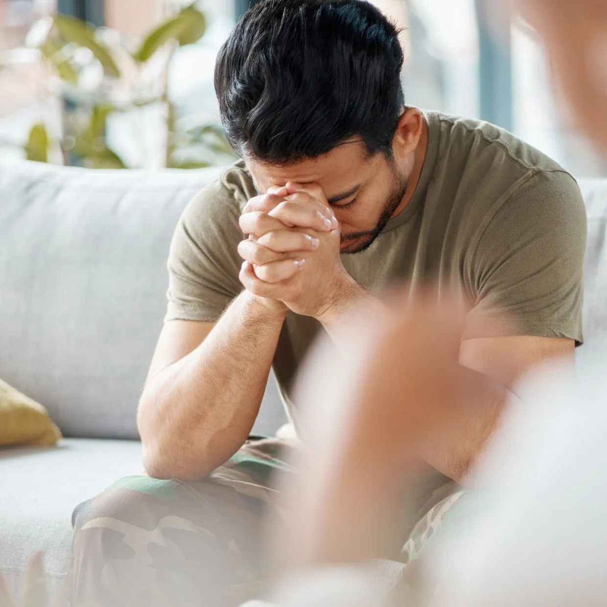 A man sitting in quiet reflection